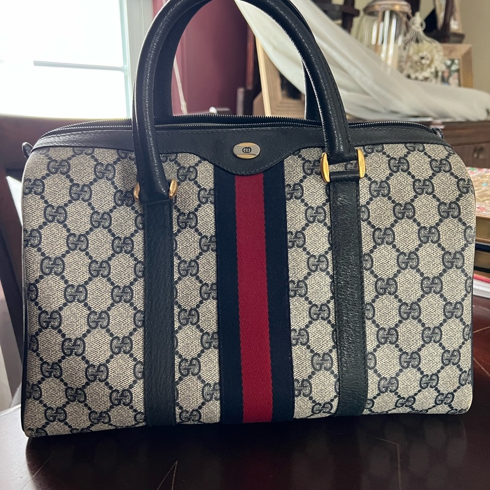 Guccis top handle bag